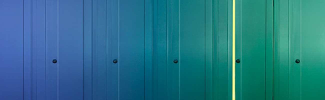 several closed doors with one cracked open