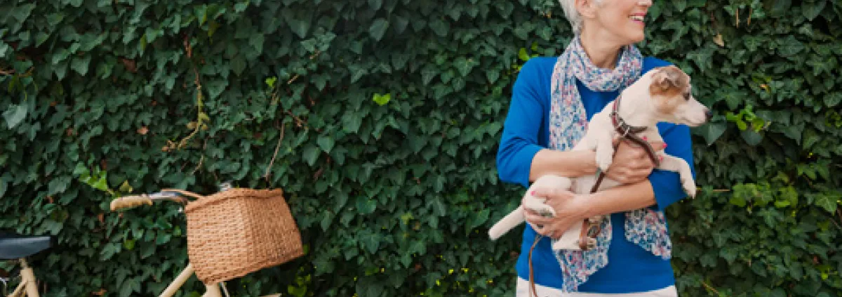 Older woman with dog and bike
