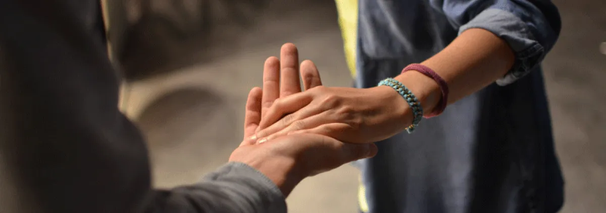 a couples hands clasped