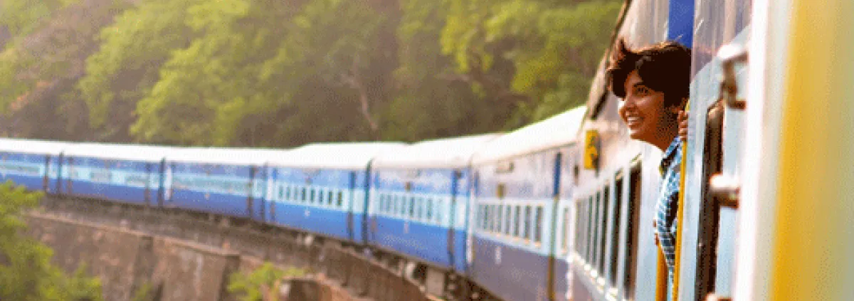 woman looking out of a train window