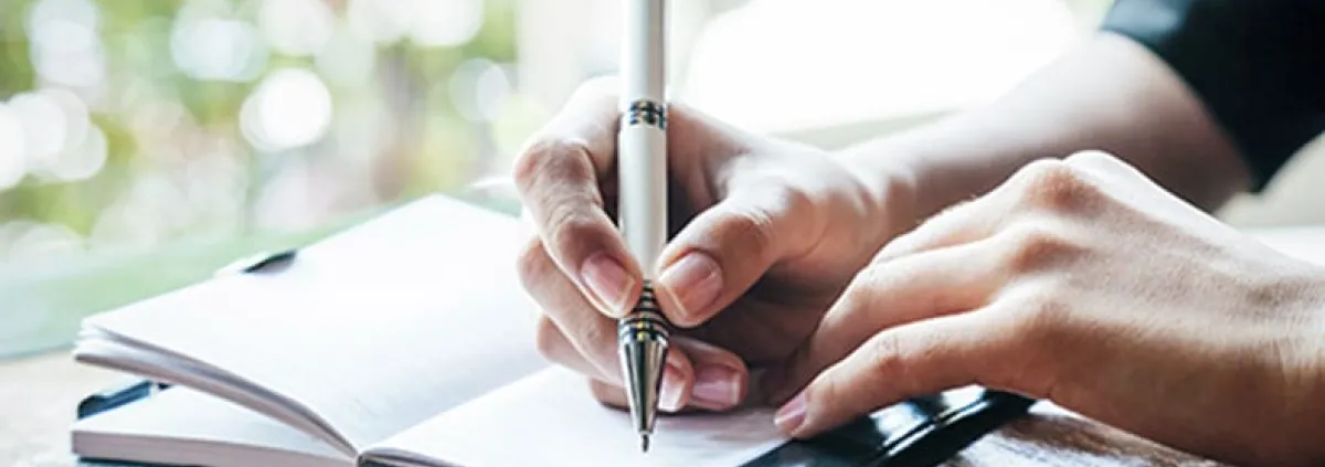 hand writing in a journal