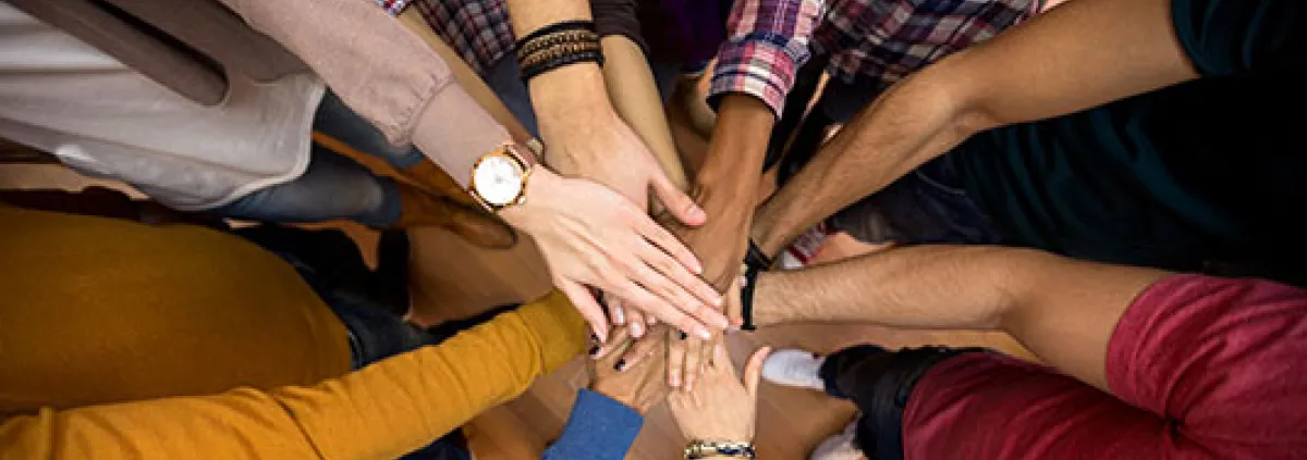 several hands in the middle