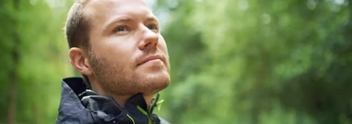man's face amid nature