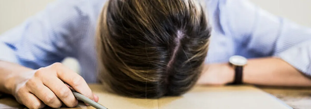 Head laying on Table